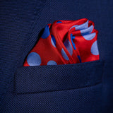 'Planetarium' polka dot silk pocket square in red with blue dots by Otway & Orford folded in top pocket
