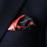 1960s sports car design silk pocket square in red and grey by Otway & Orford folded in top pocket of jacket.