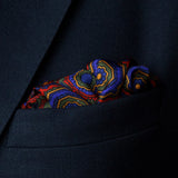 Whirligig medallion design silk pocket square in red by Otway & Orford folded in top pocket