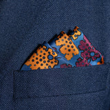 Leaf design silk pocket square in blue, burgundy & gold by Otway & Orford folded in top pocket