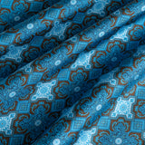 Close up of tile design silk pocket square in navy, turquoise and brown by Otway & Orford gently folded.