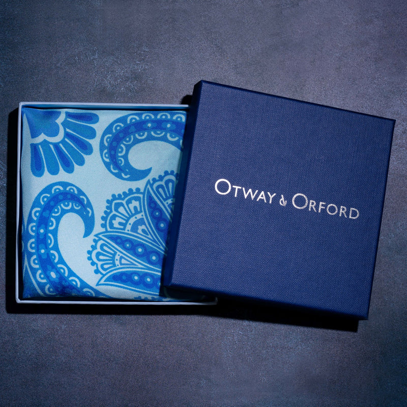 Paisley pattern silk pocket square in turquoise with blue & green by Otway & Orford folded in gift box