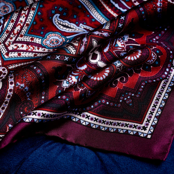 'Labyrinth' intricate paisley design silk pocket square in burgundy, red, blue & cream by Otway & Orford