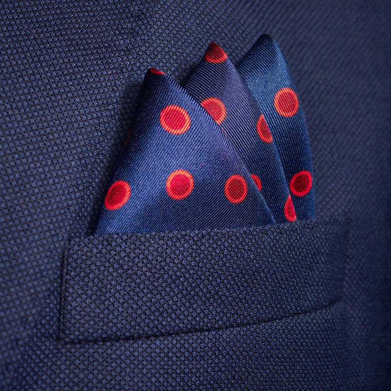 Luna polka dot silk pocket in blue with red dots by Otway & Orford folded in top pocket