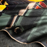 Gently folded silk pocket square featuring iconic 1960s US muscle car in Highland Green on orange background.