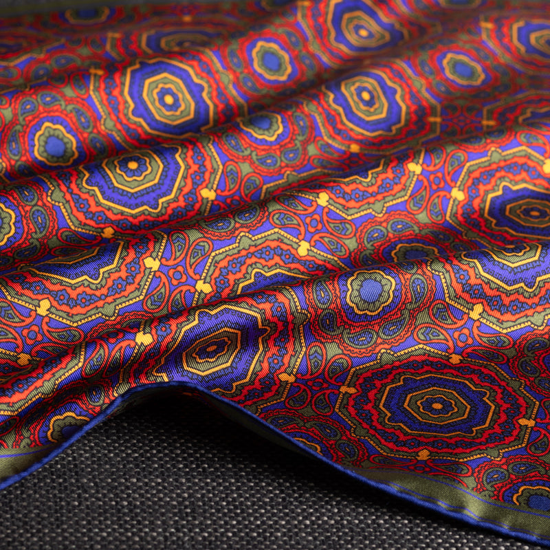 Whirligig medallion silk pocket square in red, green, blue & gold by Otway & Orford