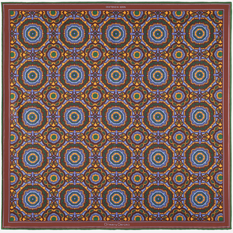 Whirligig medallion silk pocket square in blue, orange, brown & green by Otway & Orford