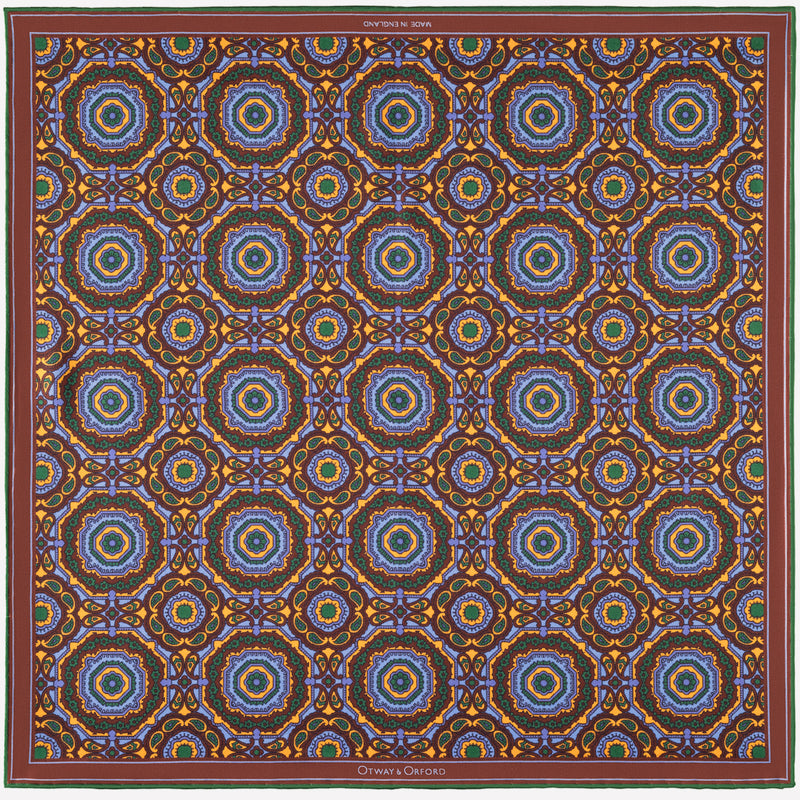 Whirligig medallion silk pocket square in blue, orange, brown & green by Otway & Orford