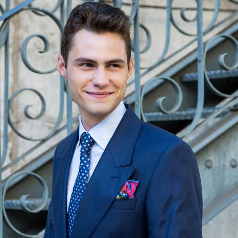 Cycling silk pocket square in blue and pink by Otway & Orford worn with mid blue suit