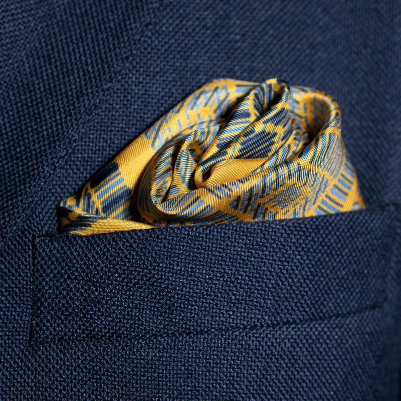 Squares design silk pocket square in gold & blue by Otway & Orford folded in top pocket