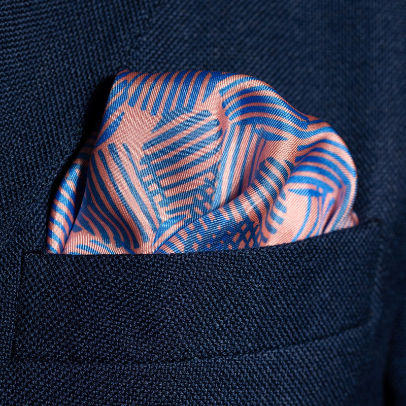 Dots design silk pocket square in pink with blue by Otway & Orford folded in top pocket