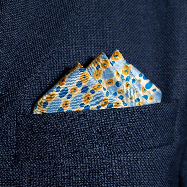 Spots design silk pocket square in blue, gold & white by Otway & Orford folded in top pocket