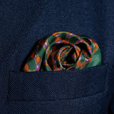 Spots design silk pocket square in green, orange & purple by Otway & Orford folded in top pocket