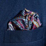 Intricate paisley design silk pocket square in blue, burgundy & gold by Otway & Orford folded in top pocket