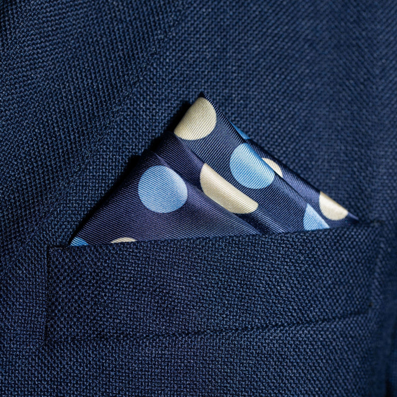 Polka dots design silk pocket square in blue with pale blue and off-white by Otway & Orford folded in top pocket