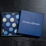 Polka dots design silk pocket square in blue with pale blue and off-white by Otway & Orford folded in gift box