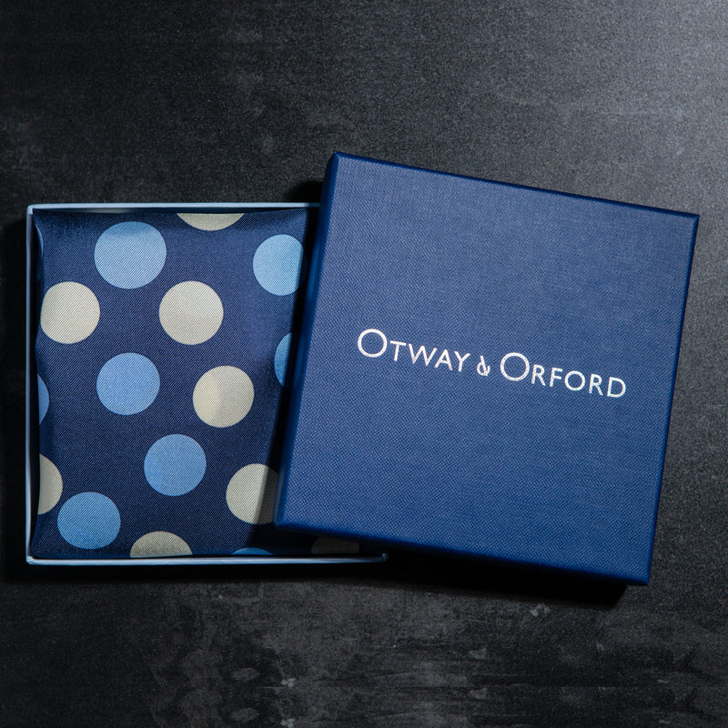 Polka dots design silk pocket square in blue with pale blue and off-white by Otway & Orford folded in gift box