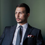 Italian Job inspired silk pocket square in red, white and grey by Otway & Orford worn with grey suit