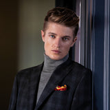 Rugby scrum silk pocket square in red and white by Otway & Orford worn with grey check suit
