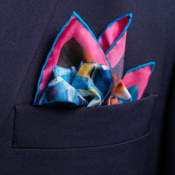 Cycling silk pocket square in blue and pink by Otway & Orford folded 1